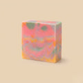Colorful swirled soap bar on a beige background