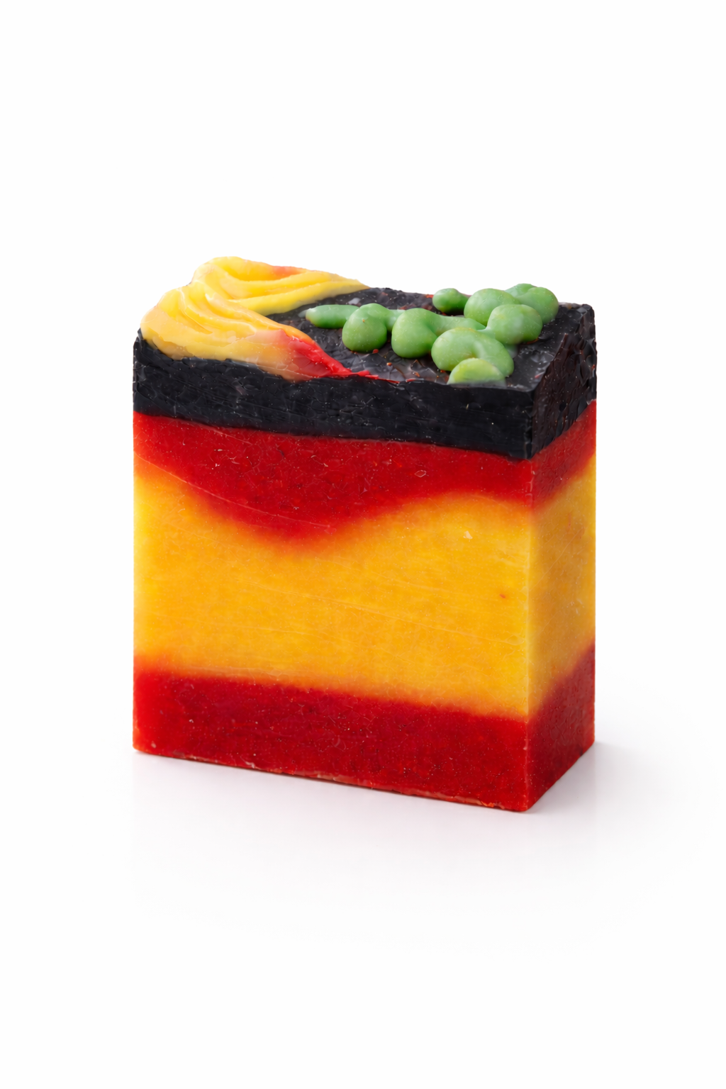 Colorful layered soap bar with yellow, red, and green on a white background